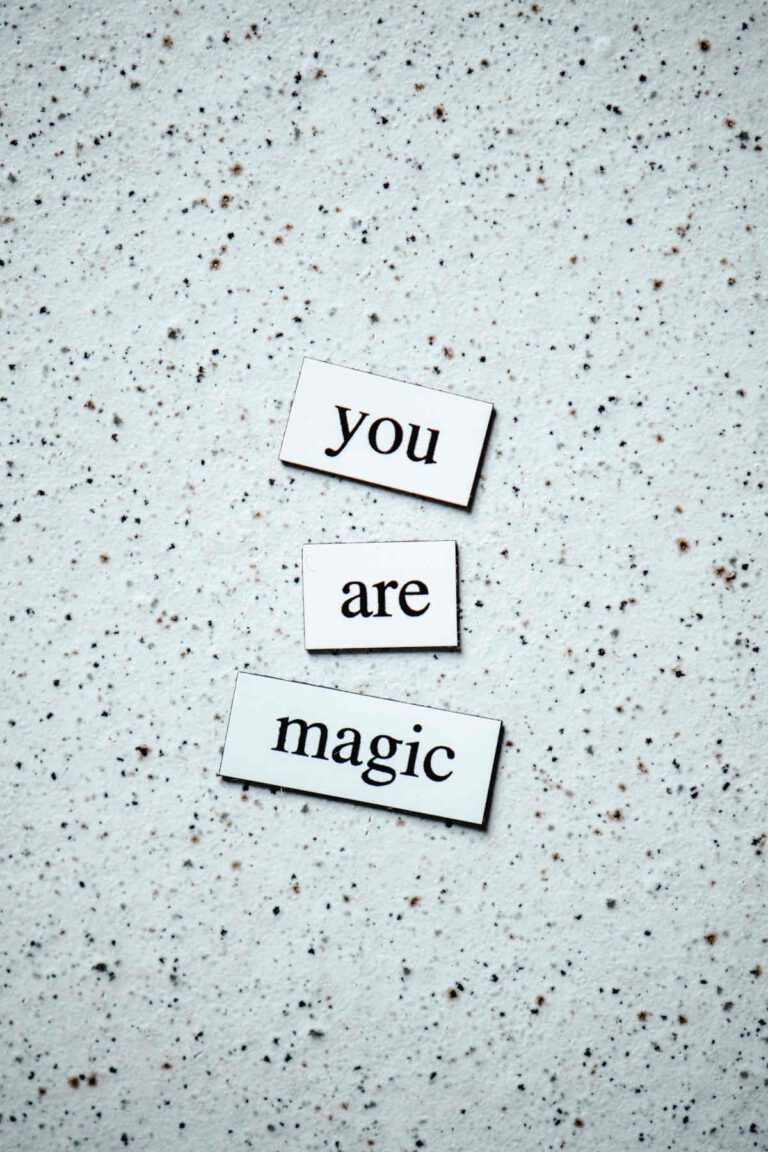 Magnetic words on a speckled background, saying 'you are magic'.